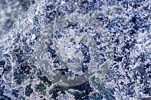 Macro mineral stone Dumortierite on white background photo