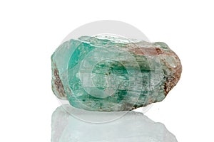 Macro mineral stone emerald on a white background