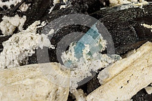 Macro mineral stone Feldspar and Aquamarine and Tourmaline on a white background