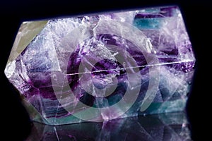 Macro mineral stone Fluorite crystal on a black background