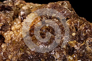 Macro mineral stone Grossular, Garnet, Epidote on a black background