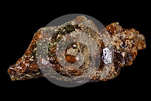 Macro mineral stone Grossular, Garnet, Epidote on a black background