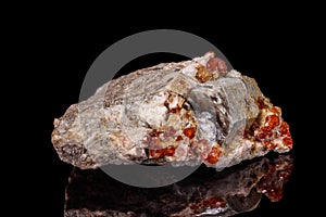 Macro mineral stone Grossular, Garnet, Epidote on a black background