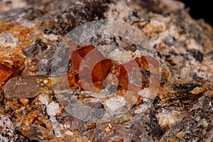 Macro mineral stone Grossular, Garnet, Epidote on a black background