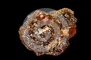 Macro mineral stone Grossular, Garnet, Epidote on a black background