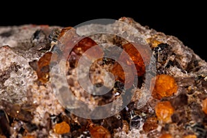 Macro mineral stone Grossular, Garnet, Epidote on a black background