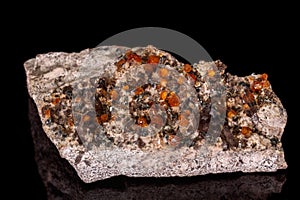 Macro mineral stone Grossular, Garnet, Epidote on a black background