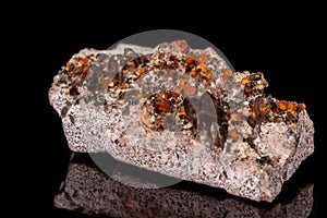 Macro mineral stone Grossular, Garnet, Epidote on a black background