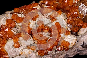 Macro mineral stone Grossular, Garnet, Epidote on a black background