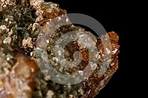 Macro mineral stone Grossular, Garnet, Epidote on a black background