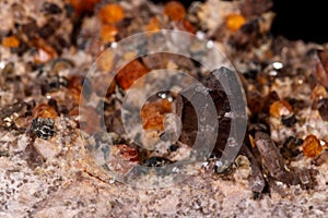 Macro mineral stone Grossular, Garnet, Epidote on a black background