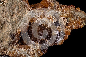 Macro mineral stone Grossular, Garnet, Epidote on a black background