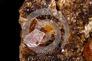 Macro mineral stone Grossular, Garnet, Epidote on a black background