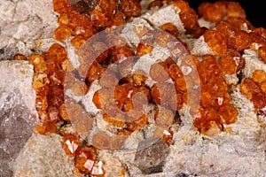 Macro mineral stone Grossular, Garnet, Epidote on a black background