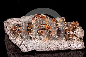 Macro mineral stone Grossular, Garnet, Epidote on a black background