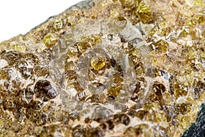 Macro mineral stone grossular on a white background