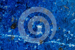 Macro of mineral stone Lazurite on a black background