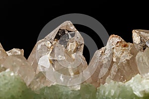 Macro mineral stone Prehnite quartz on a black background