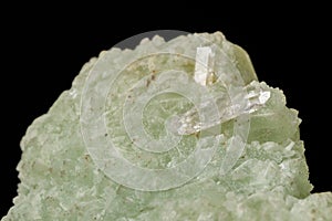 Macro mineral stone Prehnite quartz on a black background