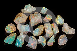 Macro mineral stone rare and beautiful opals on a black background