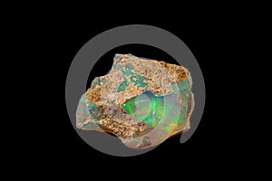 Macro mineral stone rare and beautiful opals on a black background