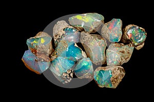 Macro mineral stone rare and beautiful opals on a black background