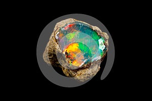 Macro mineral stone rare and beautiful opals on a black background