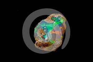 Macro mineral stone rare and beautiful opals on a black background