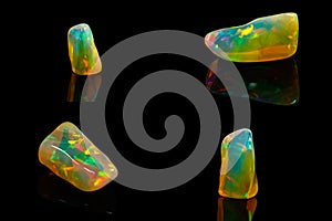 Macro mineral stone rare and beautiful opals on a black background