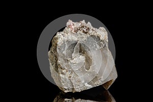 Macro of the mineral stone Rhodochrosite with fluorite on a black background