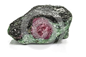 Macro of mineral stone ruby in rock on white background