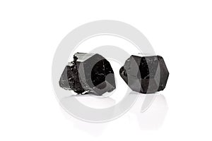 Macro mineral stone schorl, black tourmaline on white background