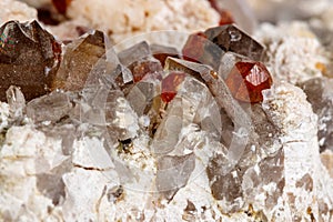 Macro mineral stone Spessartine, Feldspar, Smoky quartz, on a white background