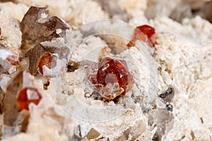 Macro mineral stone Spessartine, Feldspar, Smoky quartz, on a white background