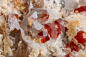 Macro mineral stone Spessartine, Feldspar, Smoky quartz, on a white background