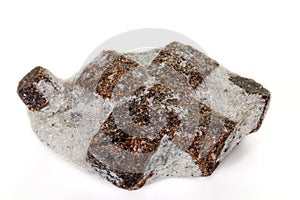 Macro mineral stone Staurolite on a white background