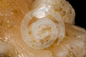 Macro mineral stone Stilbite on Apophyllite on a black background