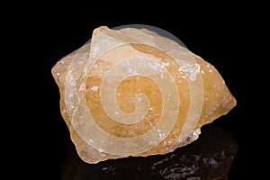 Macro mineral stone yellow calcite on white background