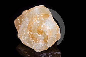 Macro mineral stone yellow calcite on white background