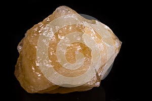 Macro mineral stone yellow calcite on white background