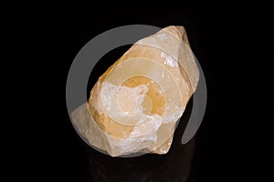 Macro mineral stone yellow calcite on white background