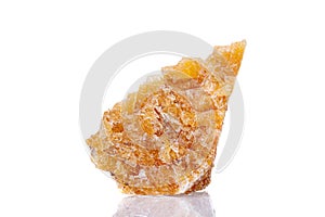 Macro mineral stone yellow calcite on a white background