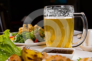 Macro Mug of Cold Beer on Dining Table
