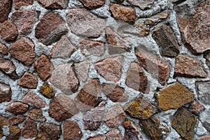 Macro of multicolored gravel pebble dash on the wall