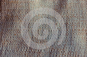 Old and dust plastic woven sack background texture.