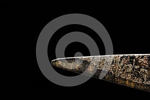 Macro old shears blade on a black background