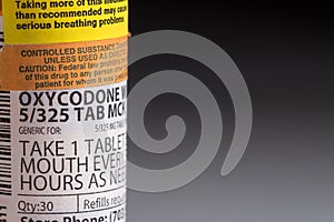 Macro of oxycodone opioid tablet bottle photo