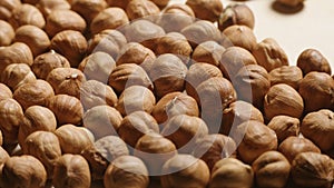 Macro of Peeled hazelnut kernels on wooden desk