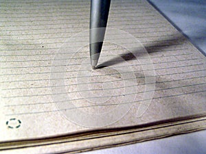 Macro of a pen on paper