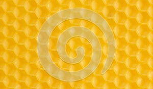 Macro photo abstract yellow background bee honeycomb wax